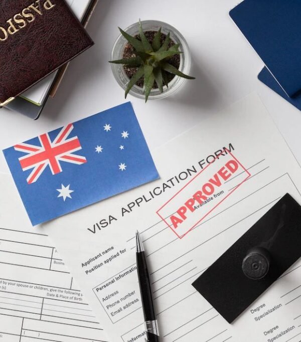 Australian flag on approved student visa application form with passport and boarding passes, symbolizing successful international study opportunities in Australia.
