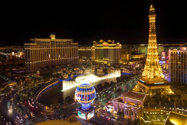 Night aerial view of Las Vegas Strip with Bellagio Fountains and Paris Las Vegas Eiffel Tower – Plan your study abroad with ASK Consultants.